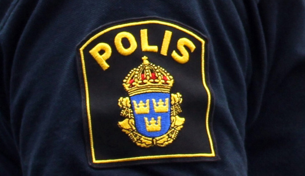 Polismärke på polisuniform